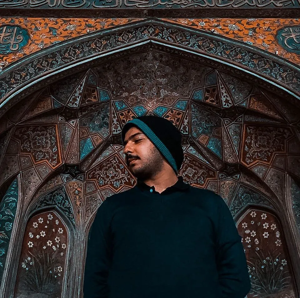 Farrukh in front of the Masjid Wazir Khan tilework, Lahore